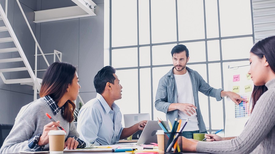 Project manager talking at a meeting at work